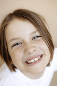 Adorable child's joyful expression in close-up portrait.